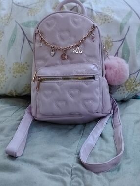 Under One Sky Lilac Quilted Heart Mini Backpack with Charm and Pom